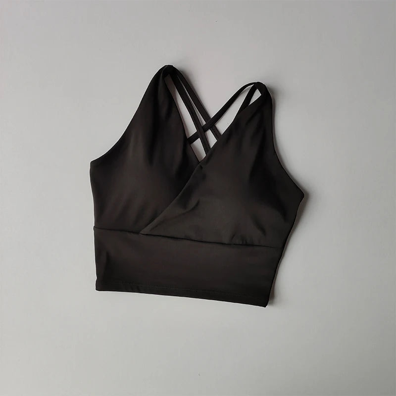Black shockproof crop top for women with crisscross straps and comfortable fit
