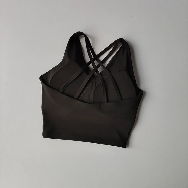 Elegant black shockproof crop top for women with stylish crisscross strap design