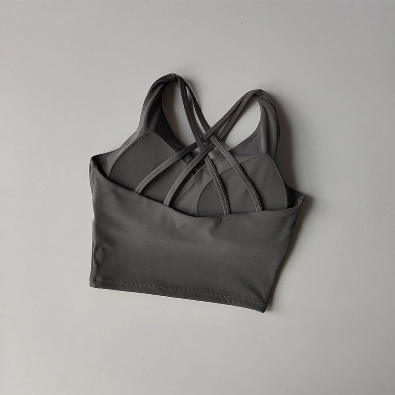 Gray shockproof crop top for women with stylish crisscross back design for active wear