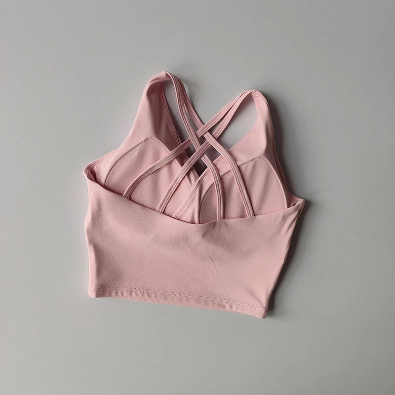 Pink shockproof crop top for women with stylish crossback design for comfort and support