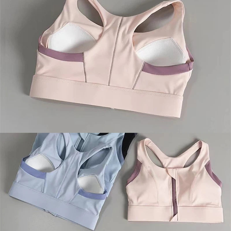 Shockproof padded gym bra for women in pink and blue with stylish back design and support features
