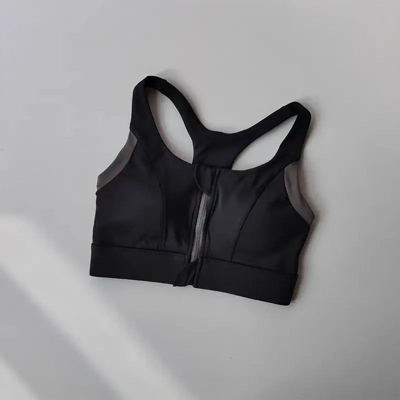 Shockproof padded gym bra for women with a zip front and supportive design in black
