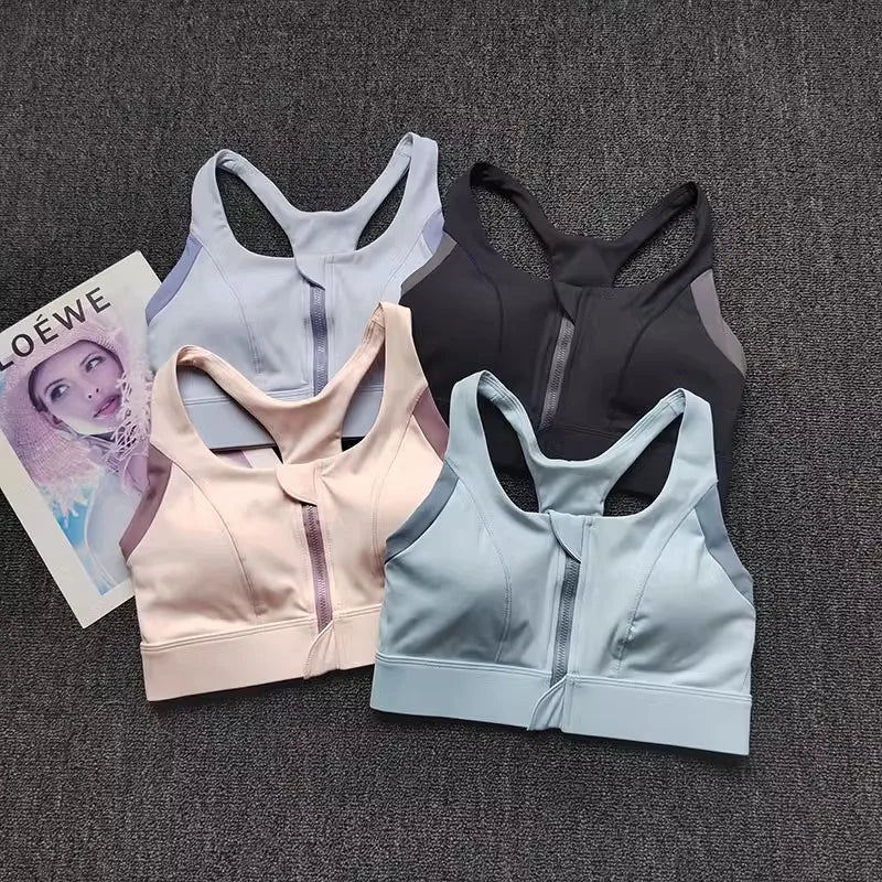 Shockproof padded gym bra for women in four colors: light blue, pink, black, and lavender