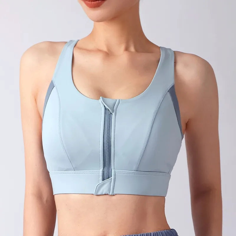 Light blue shockproof padded gym bra for women with front zipper and stylish design for comfort