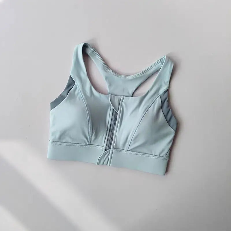 Light blue shockproof padded gym bra for women with a comfortable fit and stylish design