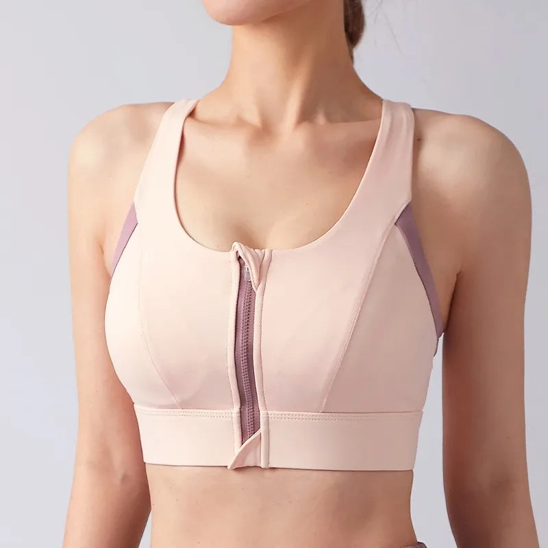 Light pink shockproof padded gym bra for women with front zipper and stylish design