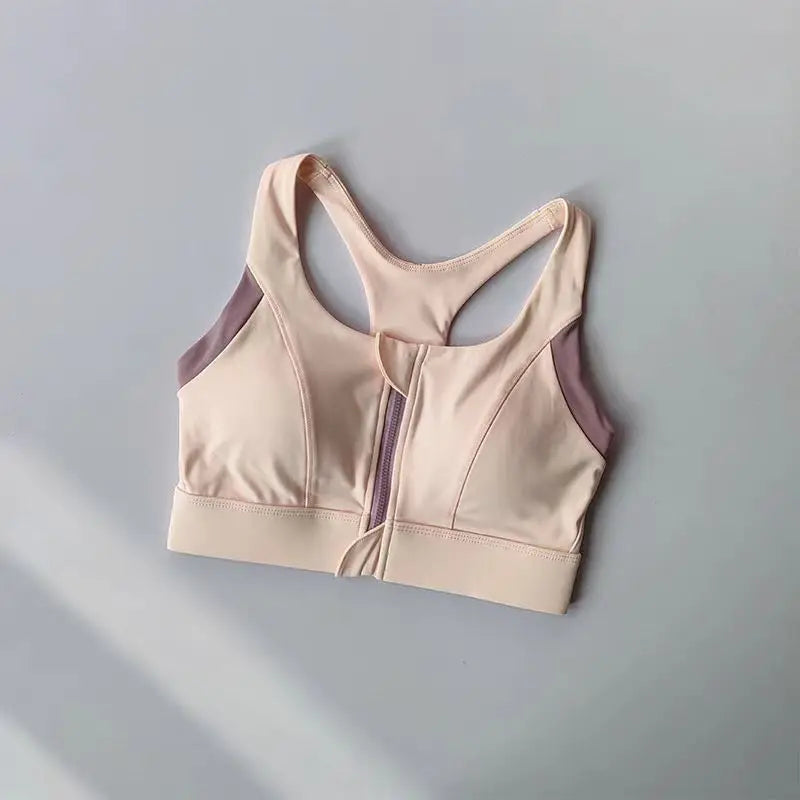 Elegant shockproof padded gym bra for women with a stylish zip front and breathable fabric