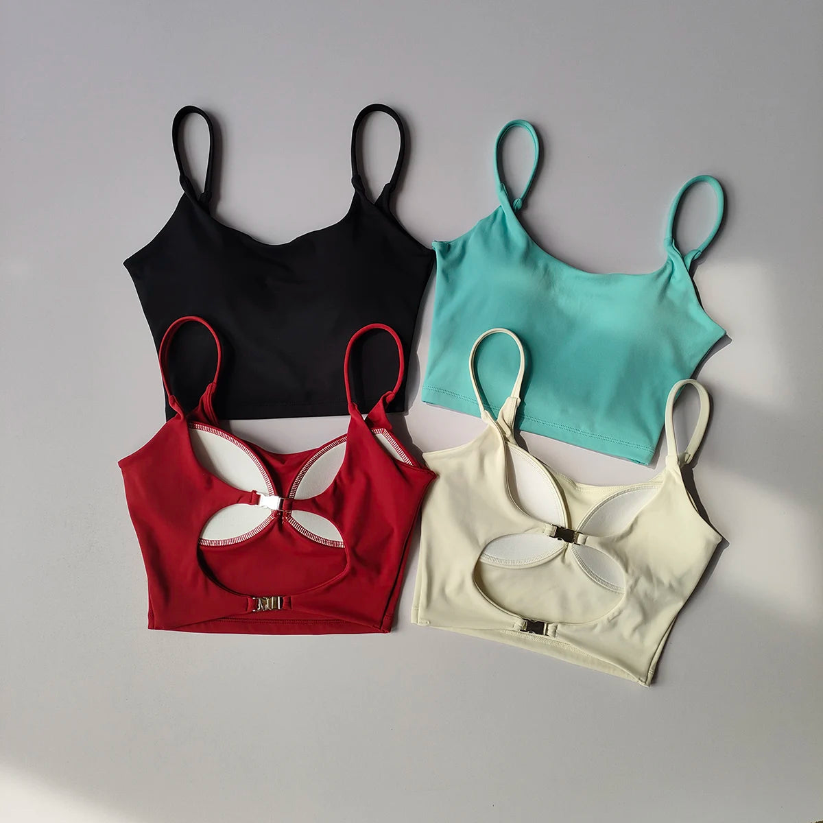 Variety of sports underwear for ladies in black, teal, red, and beige with stylish cutout designs
