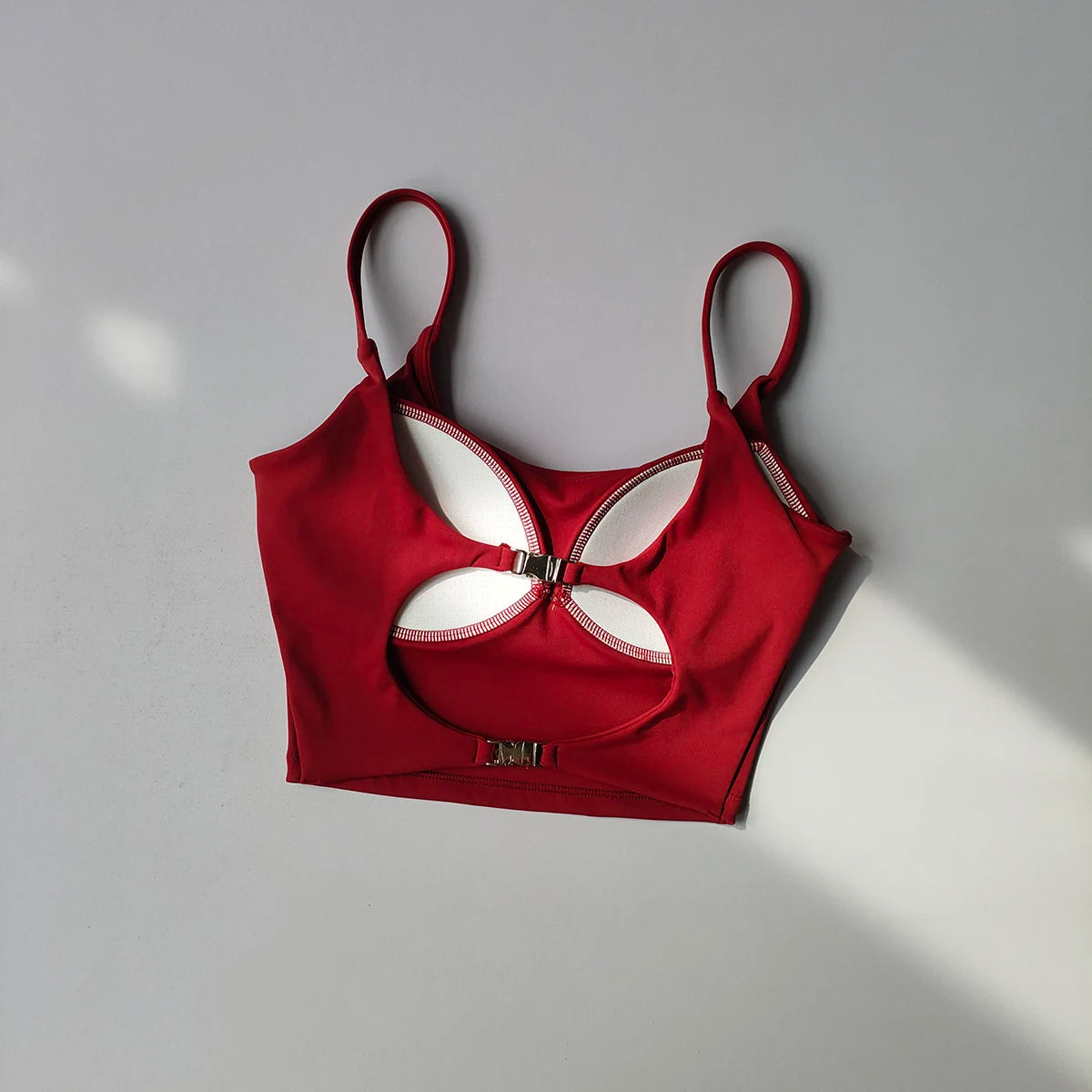 Red sports underwear for ladies with a stylish cutout design and adjustable straps