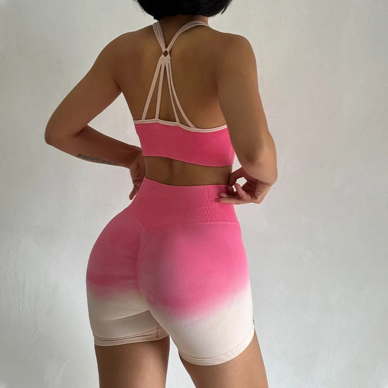 Stylish two piece athletic wear set for women featuring a pink sports bra and matching bike shorts