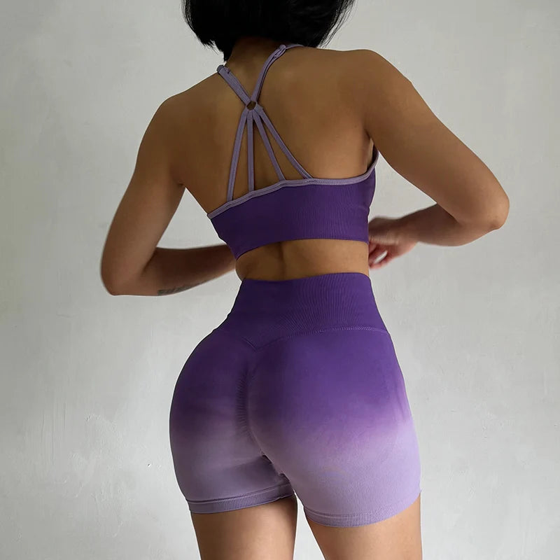 Back view of a two piece athletic wear set for women in purple ombre design with stylish straps