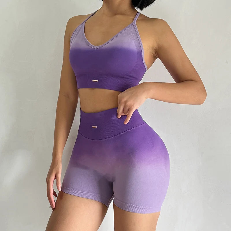 Purple gradient two piece athletic wear set for women with adjustable straps and high-waisted shorts