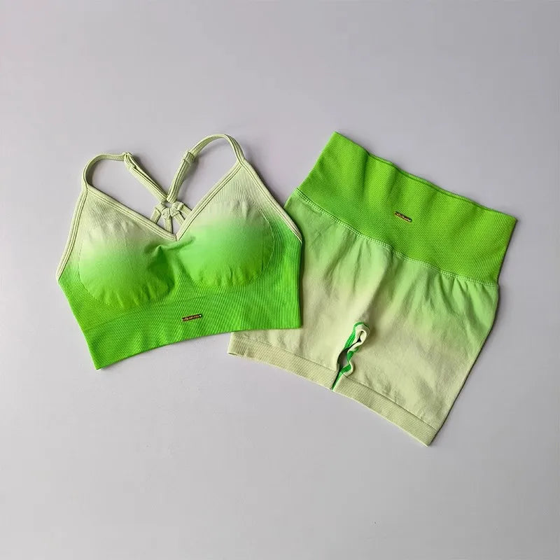 Vibrant two piece athletic wear set for women featuring a bralette and matching skirt in gradient green colors