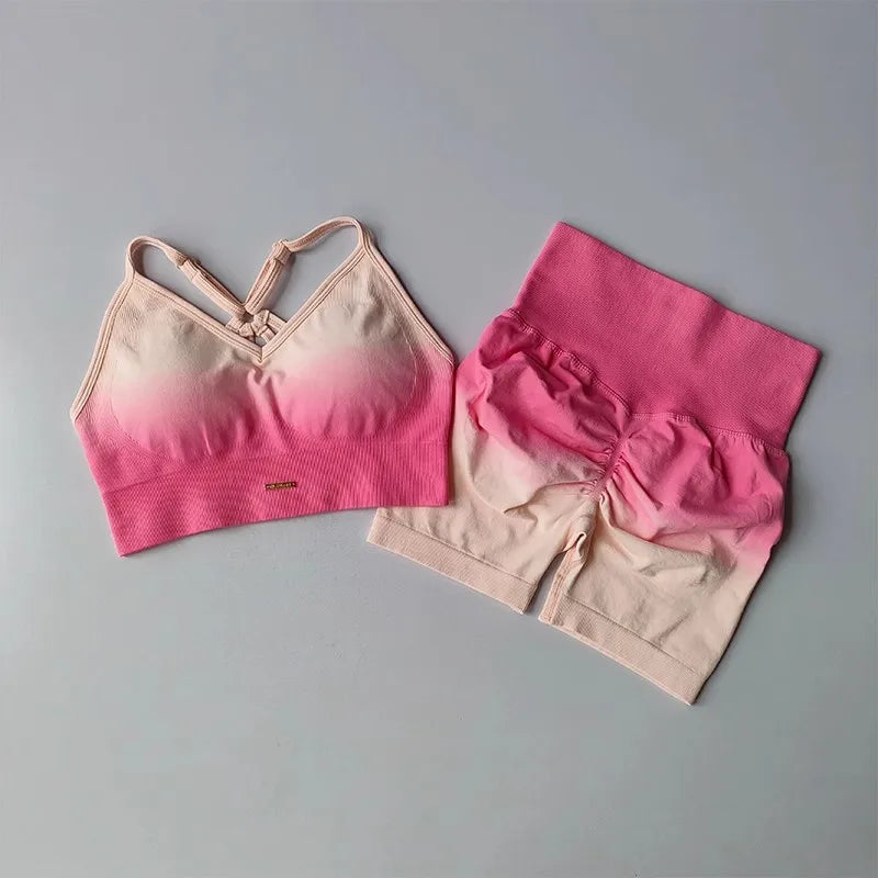 Two piece athletic wear set for women featuring a stylish sports bra and high-waisted shorts in pink ombre design