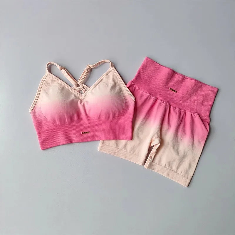 Stylish two piece athletic wear set for women featuring a crop top and high-waisted shorts in pink and beige