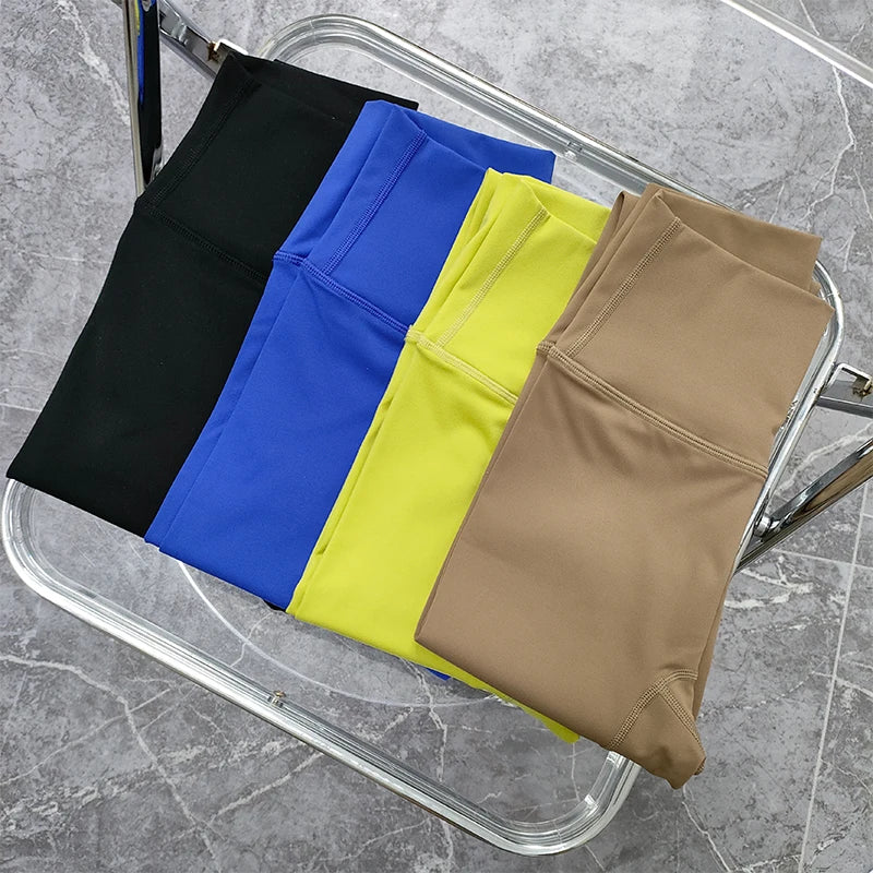 Variety of two piece workout clothing for women including black, blue, yellow, and tan leggings
