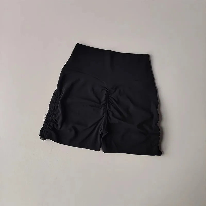 Black drawstring sports shorts for women featuring a comfortable and stylish design