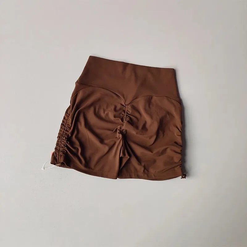Brown drawstring sports shorts for women with stylish ruched detailing and comfortable waistband