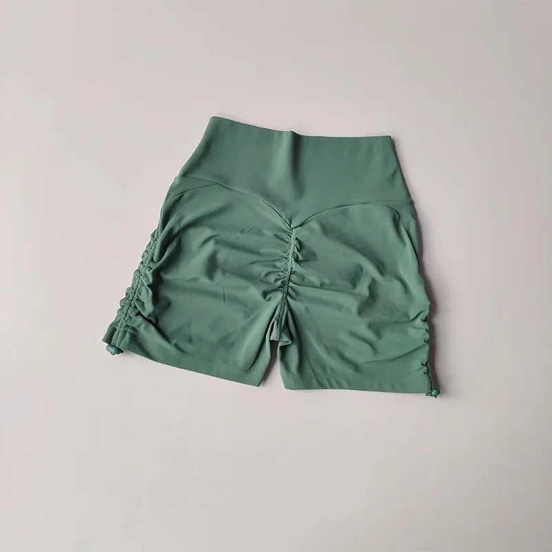 Green drawstring sports shorts for women with a comfortable fit and stylish design