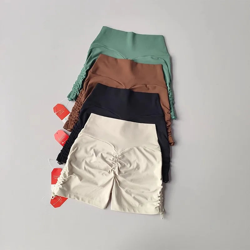 Variety of drawstring sports shorts for women in different colors displayed neatly