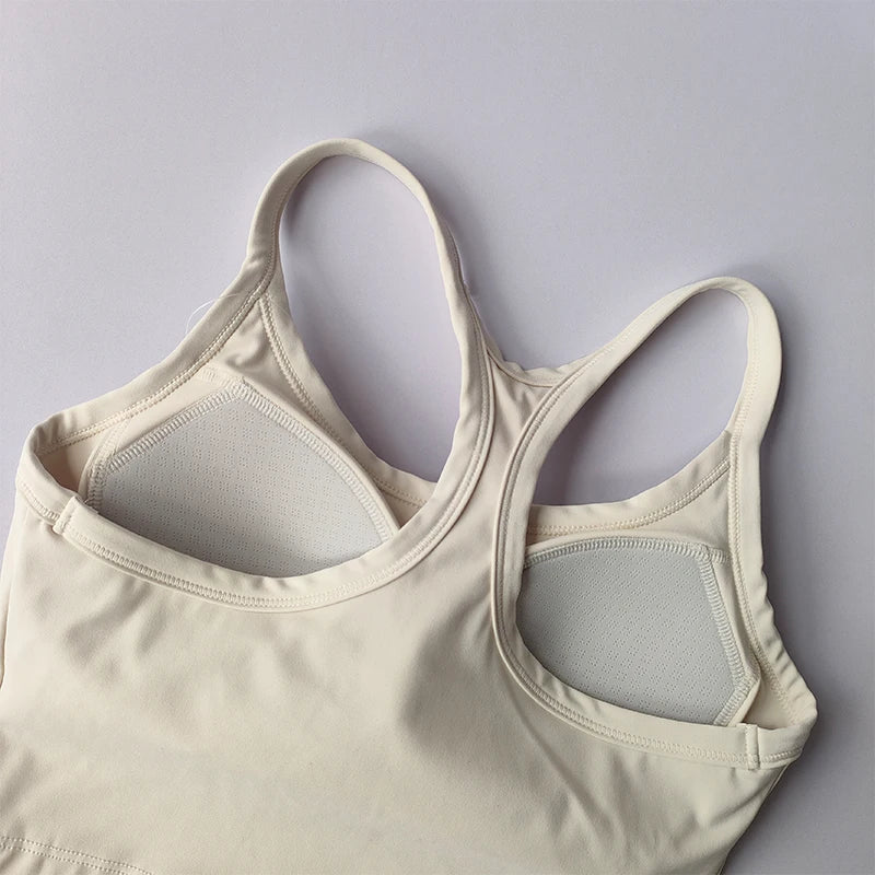 Light beige womens push up sports bra featuring padded cups and adjustable straps for comfort